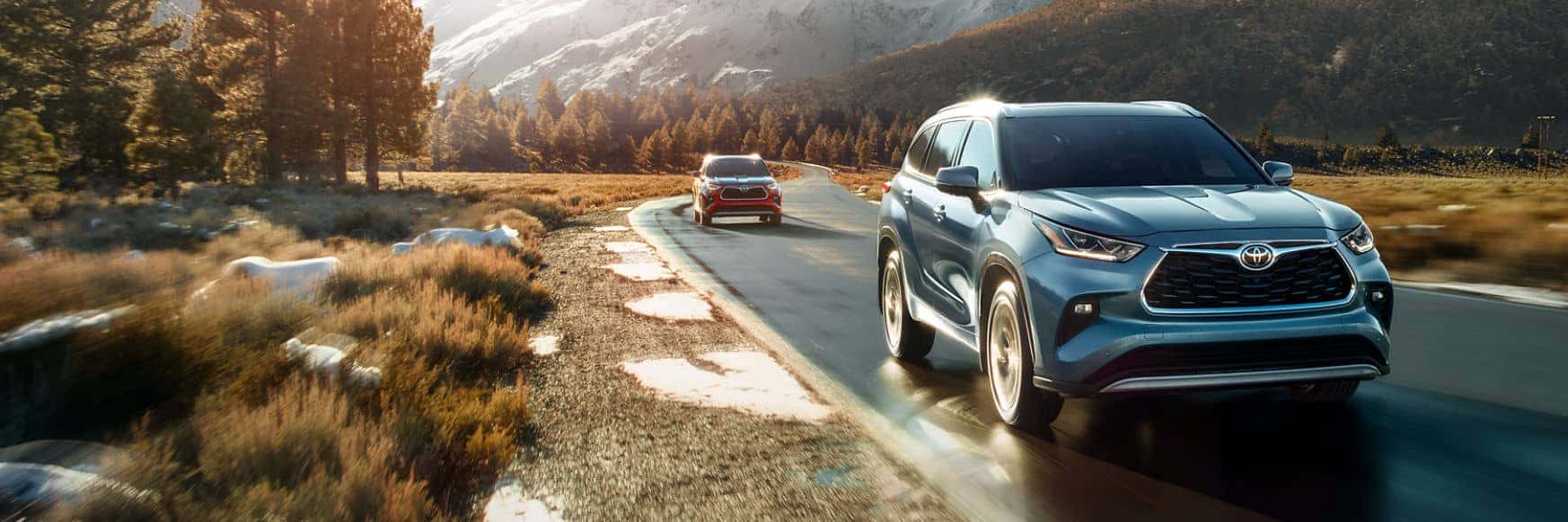 Toyota Highlander driving on a mountain road