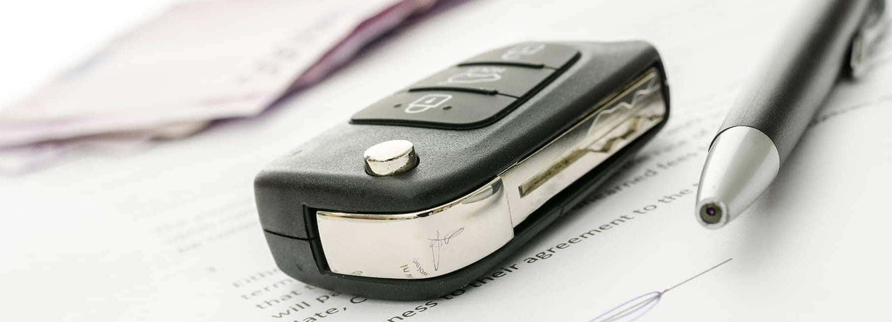 Key fob on top of a finance agreement