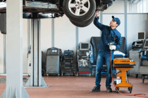 Ford Service Tech Checking Vehicle