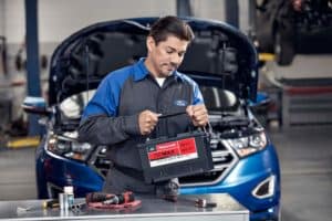 Ford Service Tech Replacing Battery in Ford Escape