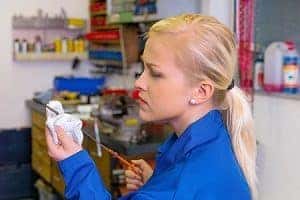 Mechanic Checking Oil Level