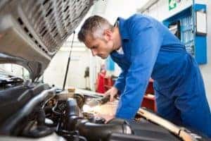 Mechanic Checking Under Hood