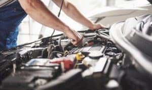 Service Advisor fixing car